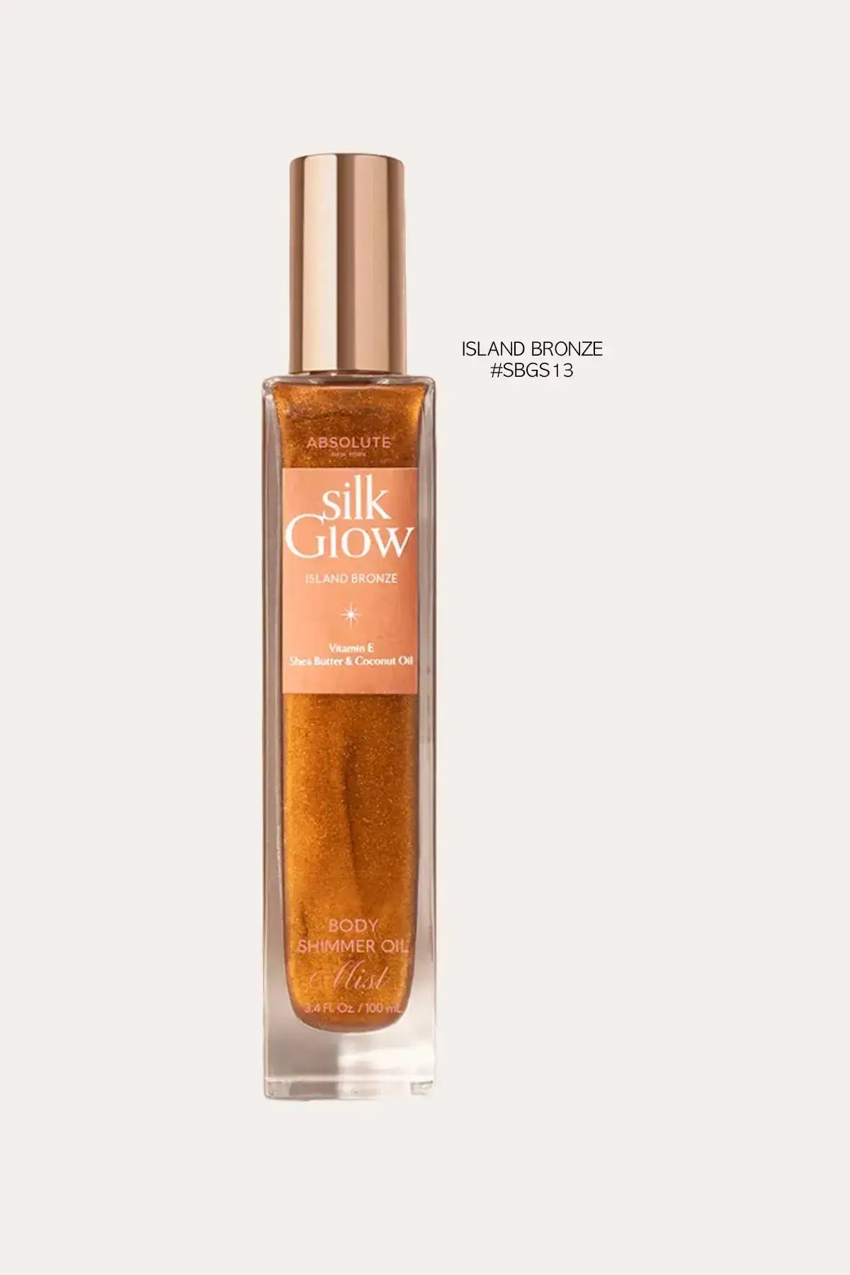 Absolute New York Silk Glow Island Bronze body shimmer oil mist, 100 mL – Scented SHIMMER Body Mist style bronze-gold shimmer bottle on a clean light background.