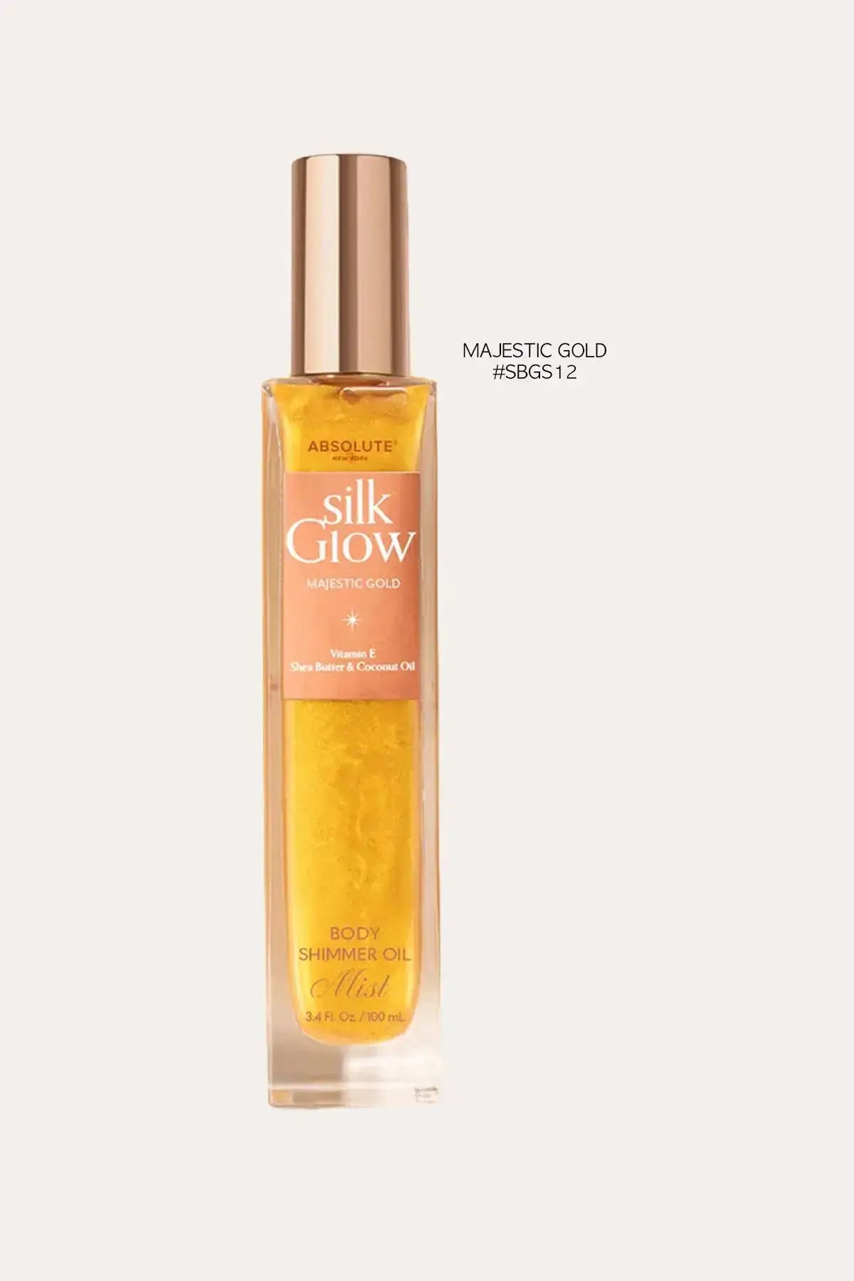 Absolute New York Silk Glow Majestic Gold body shimmer oil mist, 100 mL – Hydrating Body Shimmer MIST look with golden shimmer in a tall bottle on a light background.