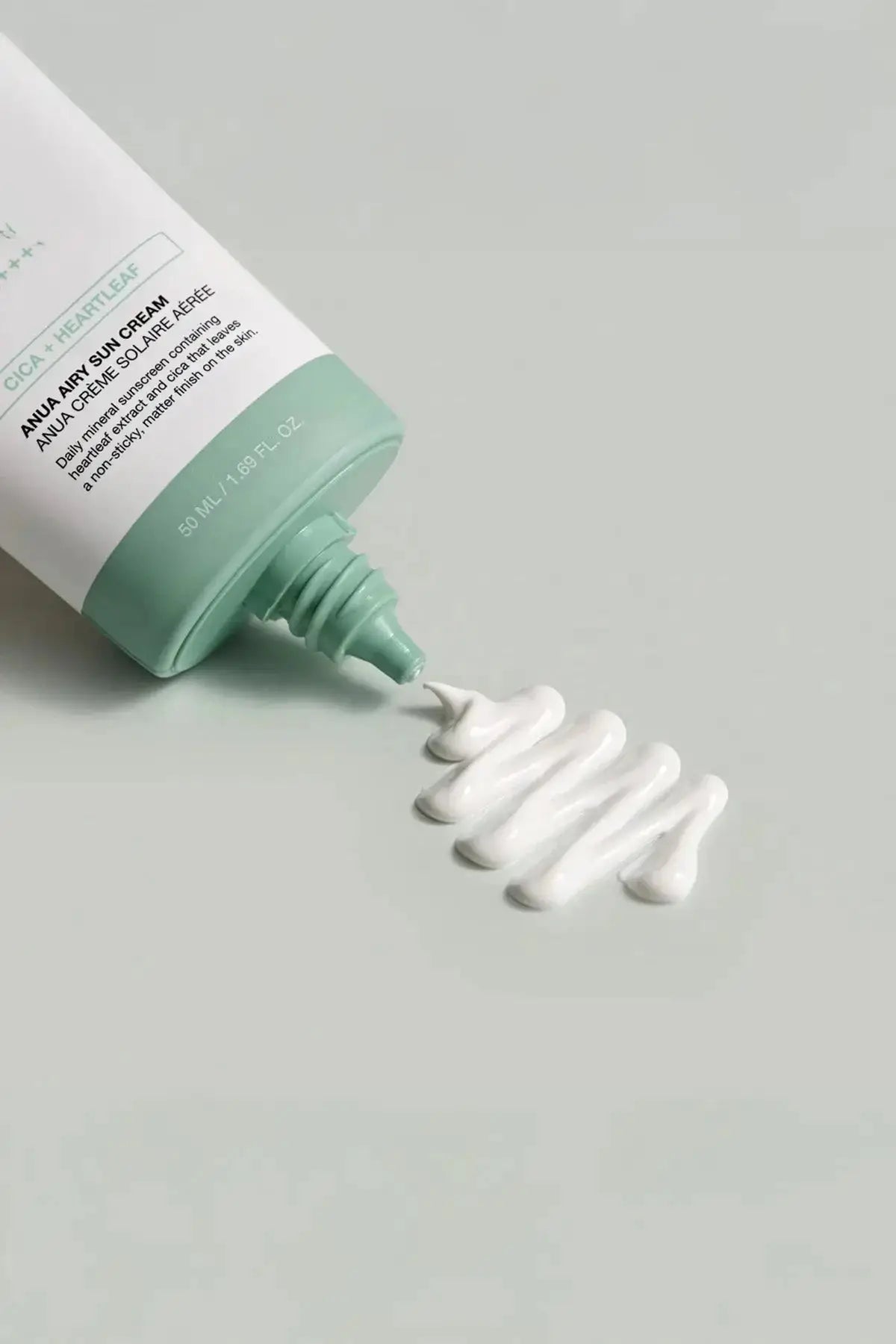 A swatch of the Anua mineral sunscreen, highlighting its soft and airy texture as an ideal sunscreen for sensitive skin.