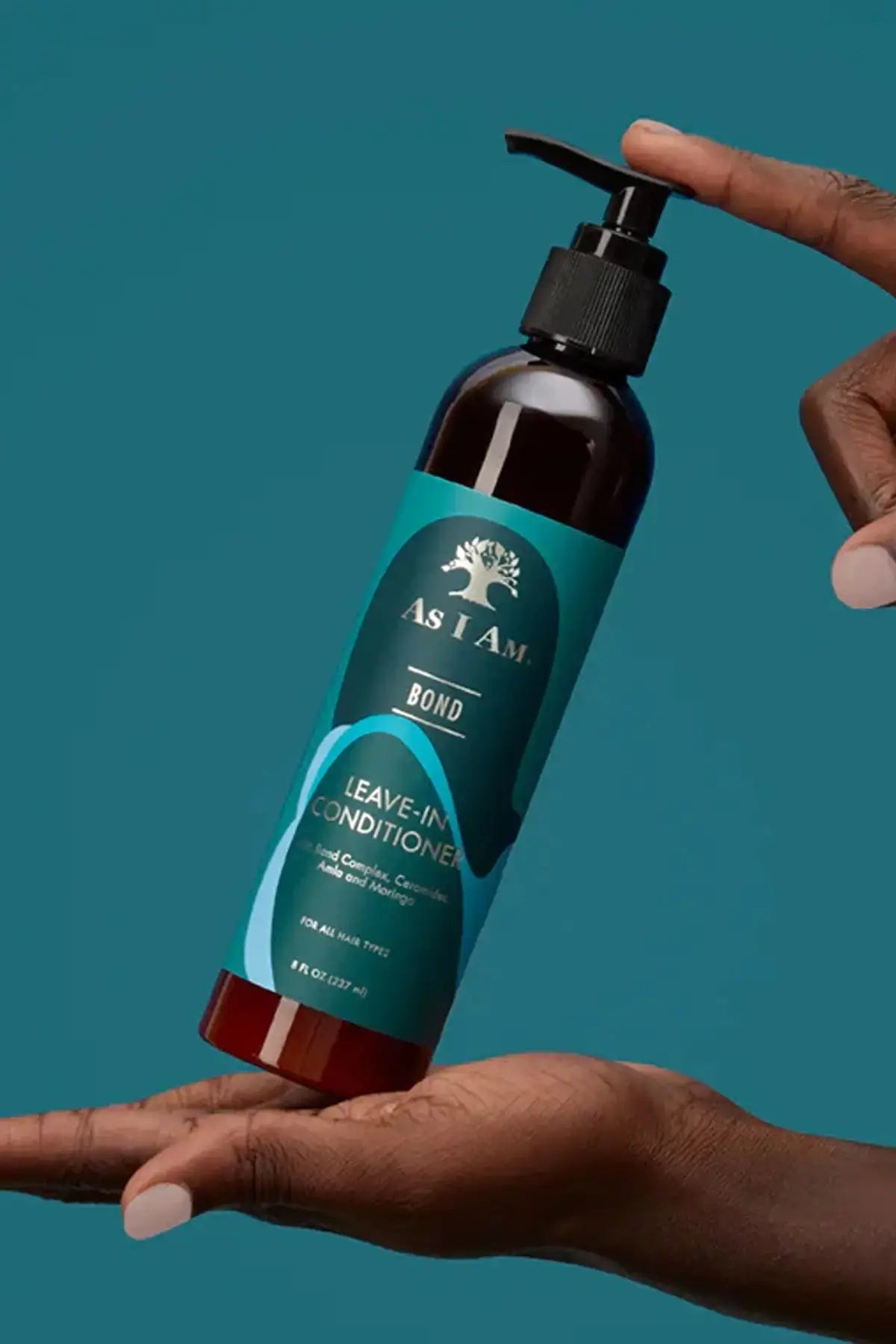 Infographic of the Lightweight Leave-In conditioner showing key ingredients: Ceramides, Amla, and Moringa for hair health.
