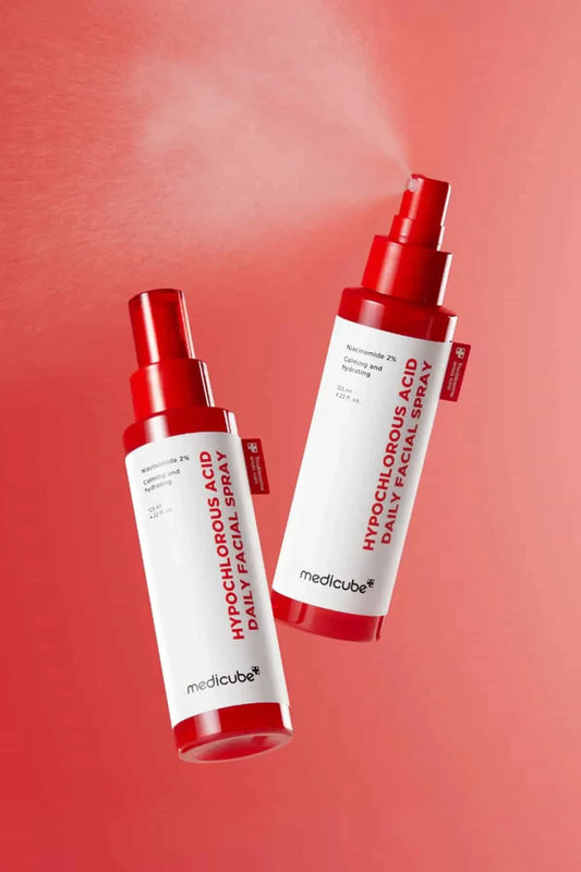 Two bottles of Medicube Hypochlorous Acid Spray, a versatile mist that works as a Body Acne Spray and facial soother.