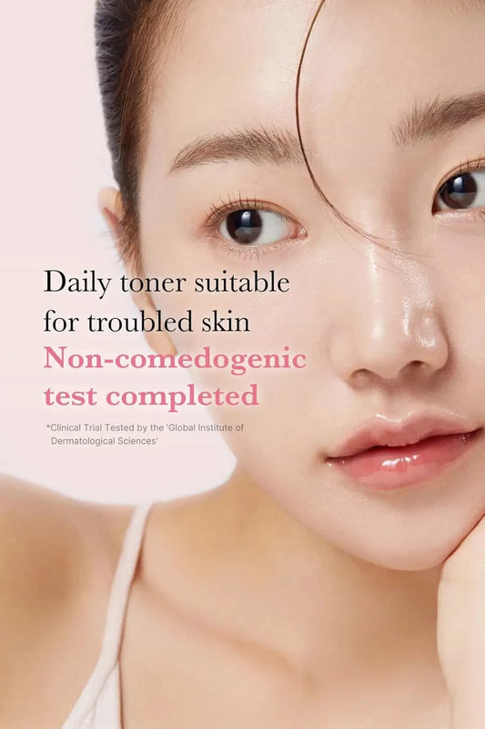 Close-up of a model with glowing skin, showcasing a daily toner that is non-comedogenic and safe FOR DRY SKIN.