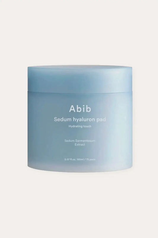 A minimalist display of Sedum Sarmentosum Skincare featuring the product jar and hygienic tweezers on a clean background.